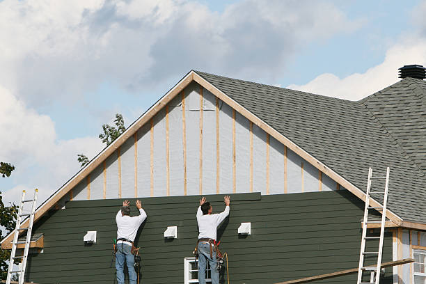 Professional Storm Damage Siding Repair technician working in Bridgeport, WV